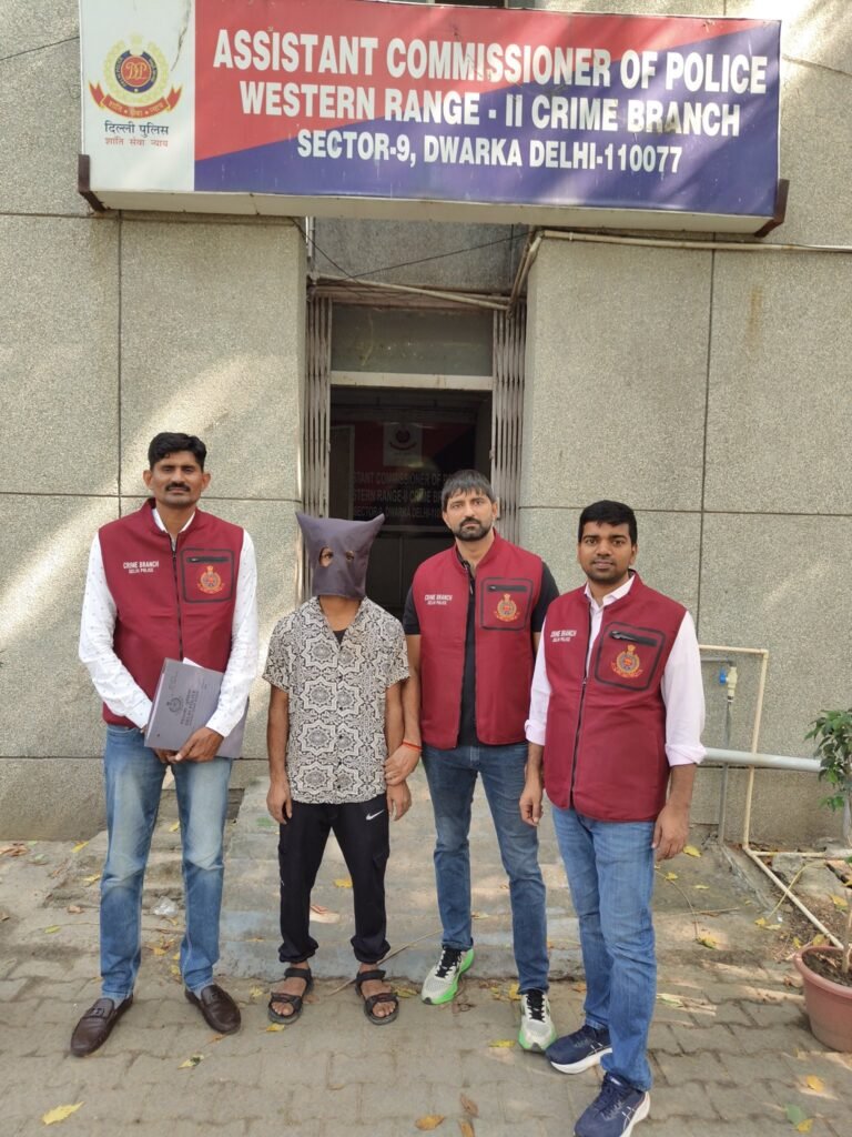 Delhi Crime Branch personnel with the arrested man outside the Western Range-II office in Dwarka