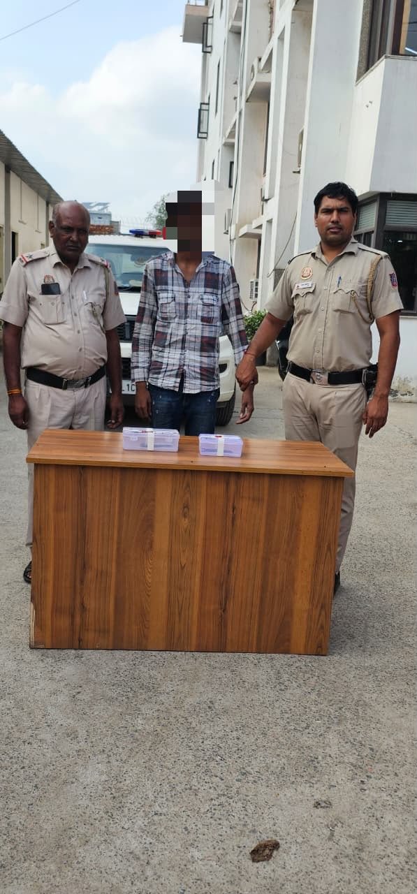 Police-supplied photograph from Samaypur Badli, with a person’s face already obscured