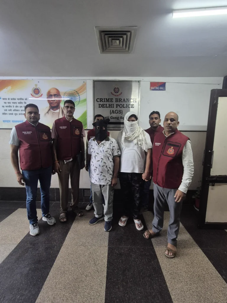 Delhi Police Arrest Two in Alleged Rs 3-Crore Extortion Case Crime Branch officers with two masked accused in the alleged Rs 3-crore extortion case