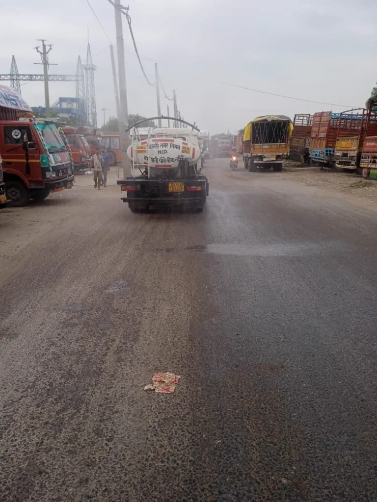 MCD water tanker sprinkling a road in the North Zone for dust control