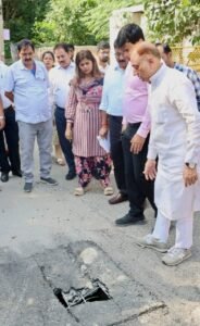 Delhi Mayor Pravesh Wahi Orders Plan to Replace Unsafe Sultanpuri Community Building Delhi Mayor Pravesh Wahi and MCD officials inspect a damaged manhole in Sultanpuri-A