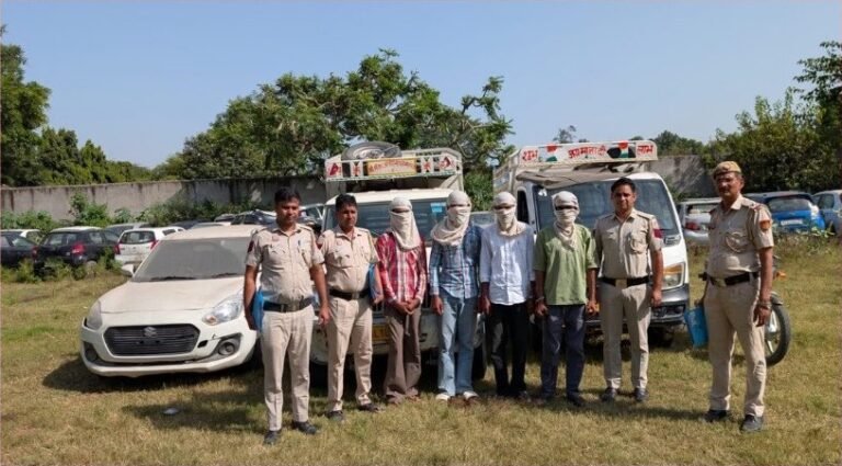 Delhi Police officers, covered-face apprehended persons and vehicles in the Maidan Garhi case