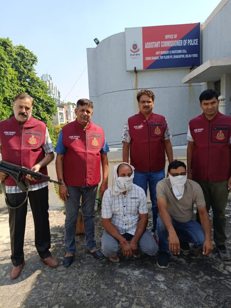 Delhi Police Crime Branch personnel with two arrested accused outside the ARSC office