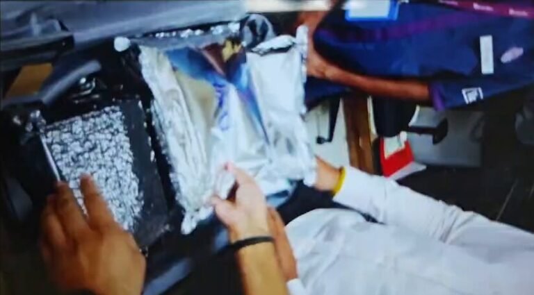 Silver-coloured packets in a suitcase during a Delhi Airport Customs search