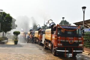 MCD anti-smog vehicles spraying water outside Civic Centre in Delhi.