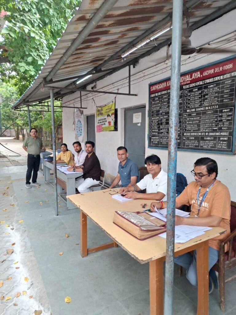 Staff seated at desks at a Delhi SIR special camp in a file photograph