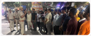 South-East Delhi police officers speak with residents during an Eyes and Ears community meeting