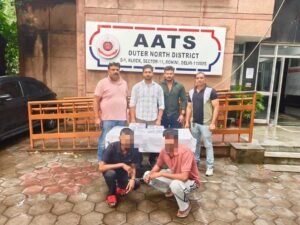 Delhi Police Say Rival Gang Hit Was Planned After Jail Release; Two Held, Two Pistols and Five Rounds Seized Outer North District AATS team with recovered weapons and two accused whose faces are pixelated