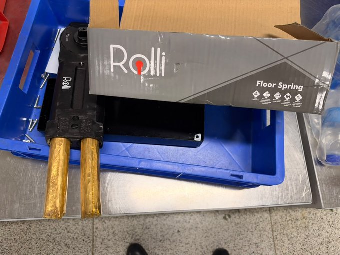 Delhi Customs Seize 3.20 Kg Gold Hidden in Floor Spring at IGI Airport Gold rods protruding from an opened floor spring recovered at IGI Airport