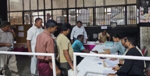 Voters and officials at a polling desk in Delhi — file photograph