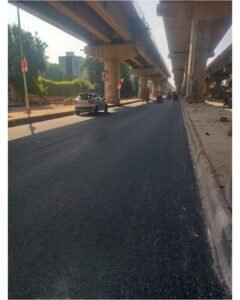 Resurfaced road beneath elevated Metro structures in Delhi