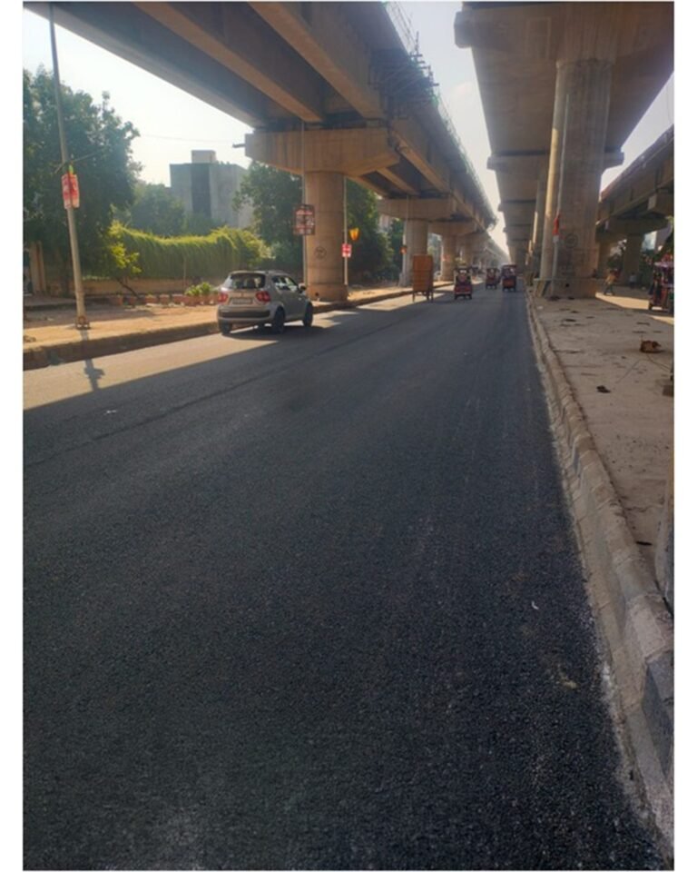Resurfaced road beneath elevated Metro structures in Delhi