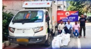 8,000 Liquor Quarters Marked for Haryana Seized in Delhi; Tempo Impounded Tempo, seized consignment and police personnel shown in the official Dwarka Police photograph