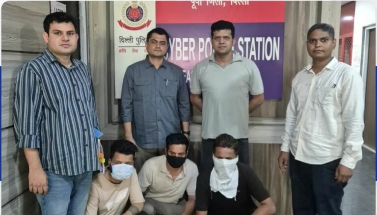 Four East District cyber police officers stand behind three face-covered suspects at a police station.