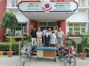 CCTV Leads East Delhi Police to Three Arrests in Separate Snatching and Theft Cases New Ashok Nagar police with two accused whose faces are covered, recovered motorcycles and phones