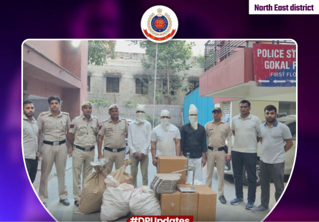 Police personnel with three apprehended people and seized firecracker material in Gokalpuri