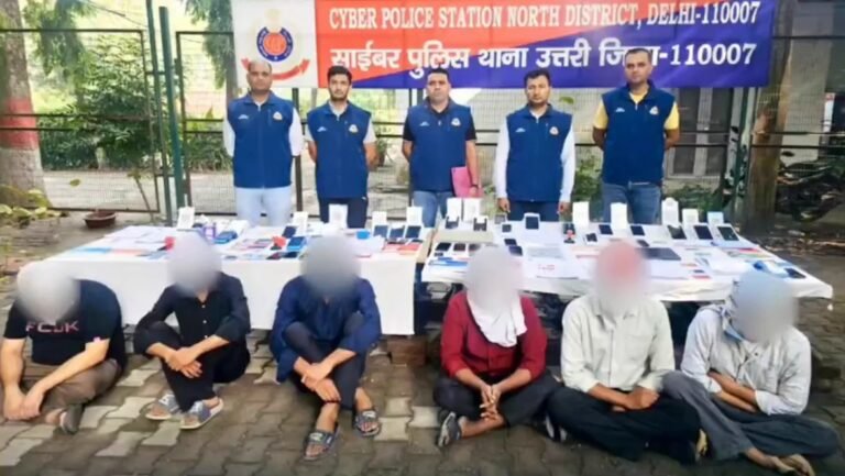 Instagram Shopping Fraud: Seven Arrested as Delhi Police Trace Rs 30-Crore Transaction Trail North Delhi cyber police personnel with seized devices and people whose faces are blurred in the official video