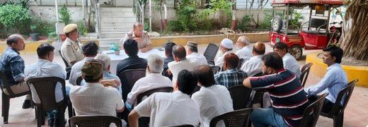 Jamia Nagar police officer meeting residents’ representatives