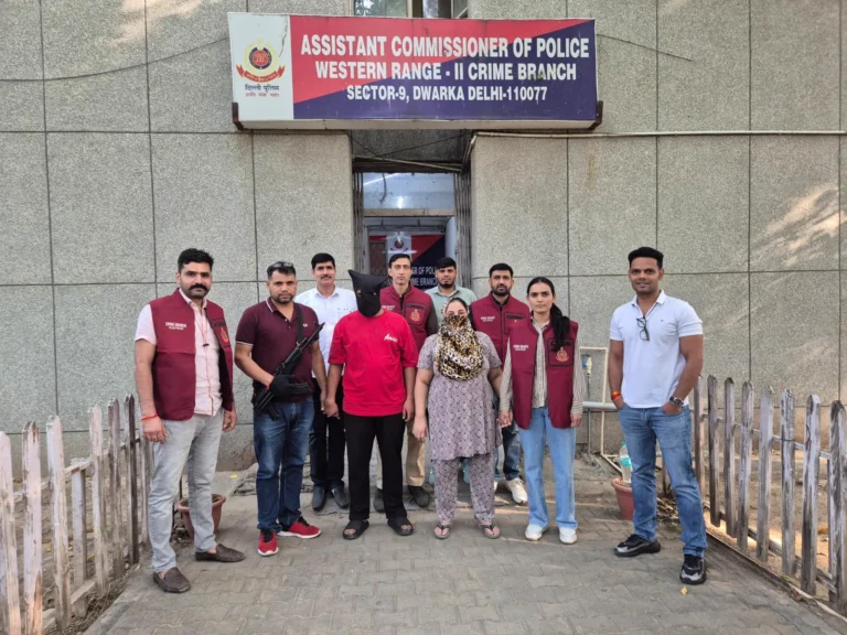 Crime Branch personnel with two face-covered individuals outside the Western Range-II office
